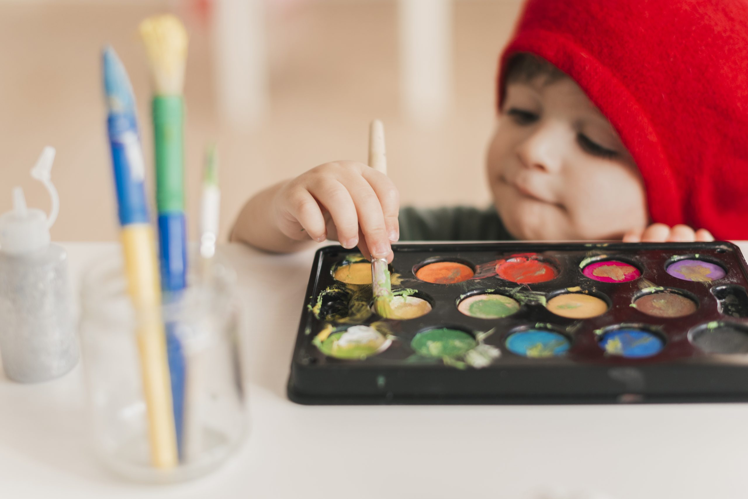 little child painting like artist
