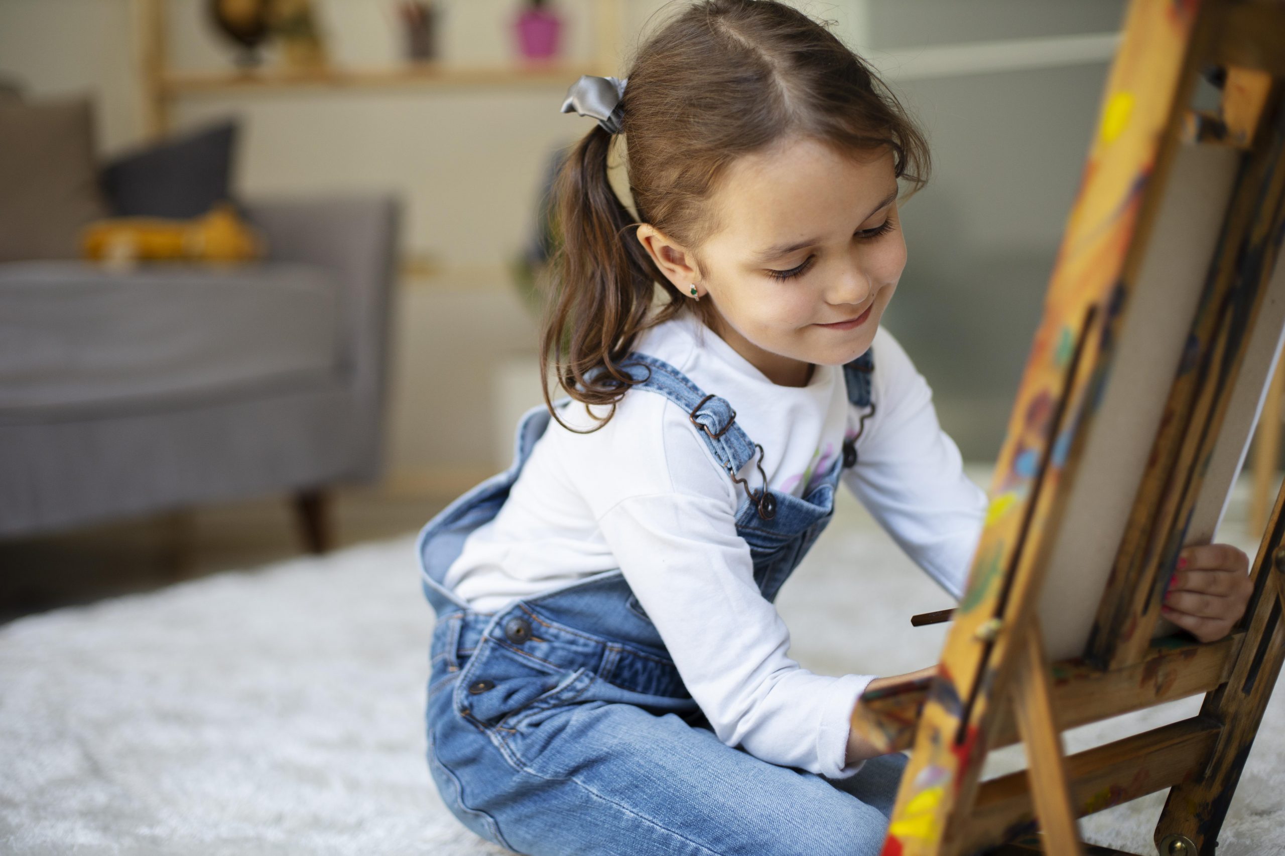 little girl learning how paint